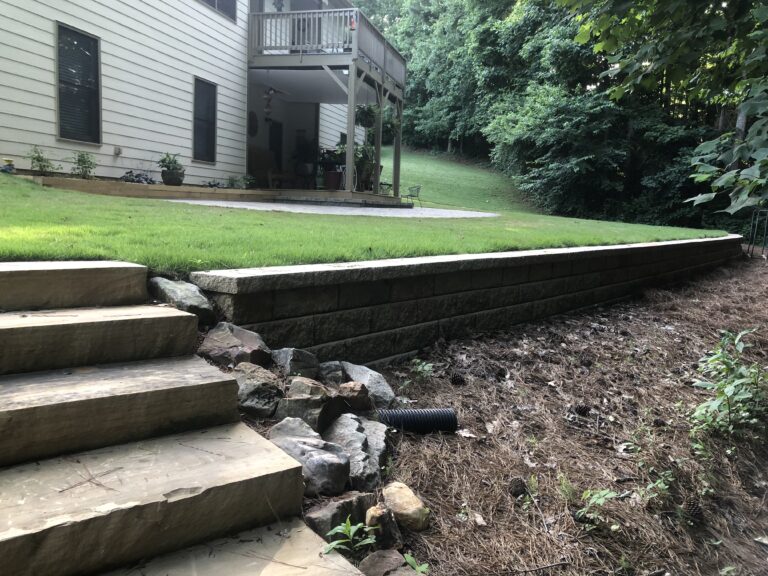 Stone retaining wall and steps with landscape plantings by Stone Edge Landscapes, North West Georgia