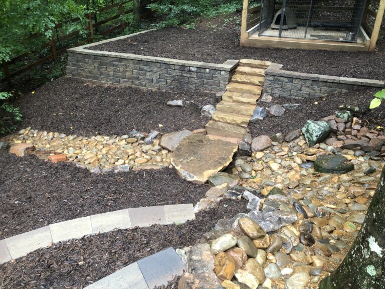 Stone retaining wall and steps with landscape plantings by Stone Edge Landscapes, North West Georgia