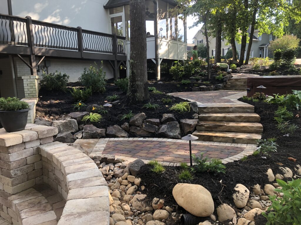 Stone retaining wall and steps with landscape plantings by Stone Edge Landscapes, North West Georgia