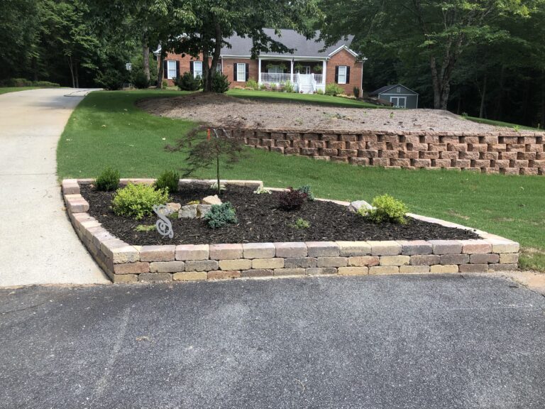 Stone retaining wall and steps with landscape plantings by Stone Edge Landscapes, North West Georgia