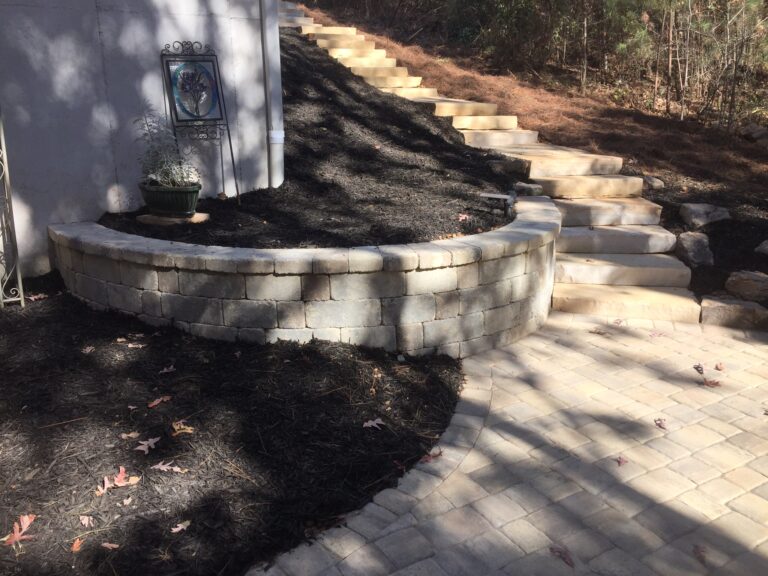 Stone retaining wall and steps with landscape plantings by Stone Edge Landscapes, North West Georgia