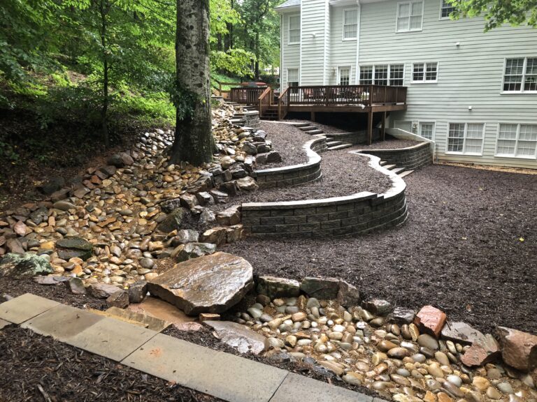 Stone retaining wall and steps with landscape plantings by Stone Edge Landscapes, North West Georgia