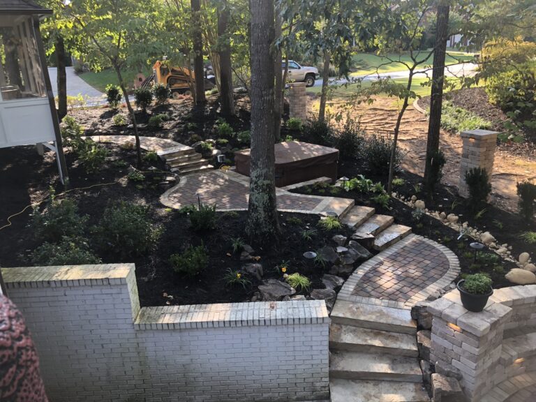 Stone retaining wall and steps with landscape plantings by Stone Edge Landscapes, North West Georgia